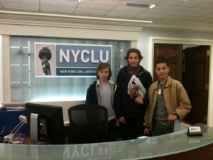 Group in Front of NYCLU Logo